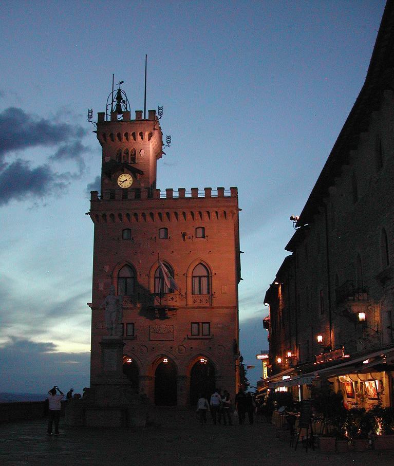 A photograph of Palazzo Pubblico, the government building of San Marino, featuring its neo-Gothic architecture and scenic surroundings.