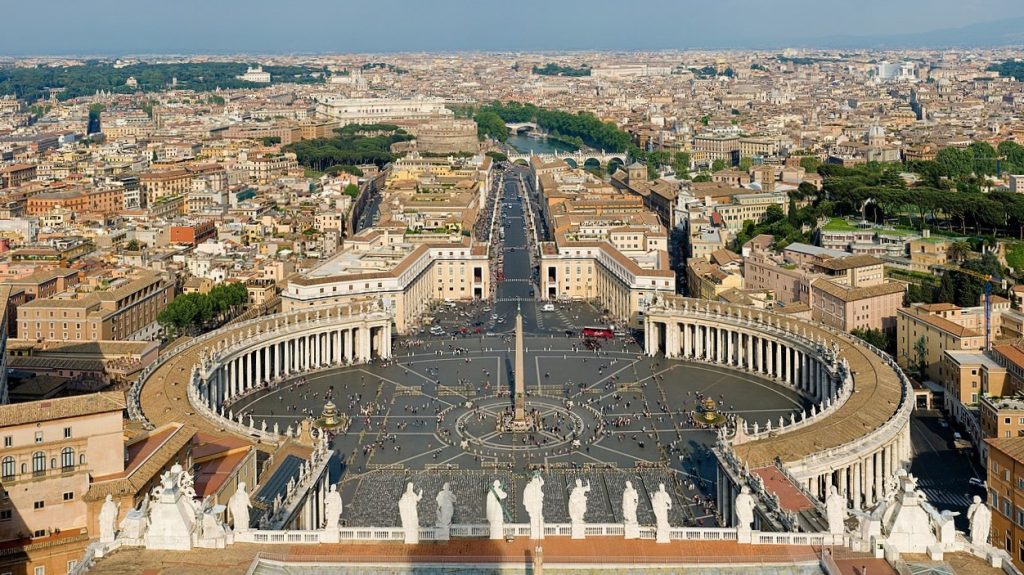 St. Peter's Square in Vatican City, featuring the iconic colonnade and St. Peter's Basilica.