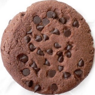 Freshly baked chocolate chip cookie, resulting from the sweet tax and financial incentives of the chocolate industry.