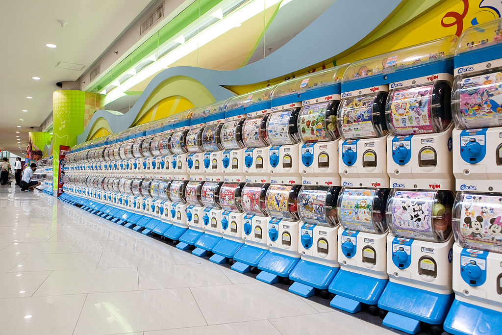Row of gachapon gambling machines. A gambling game rewarded with collectible in-game items.