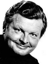 Portrait of Benny Hill smiling, before dying without a will.