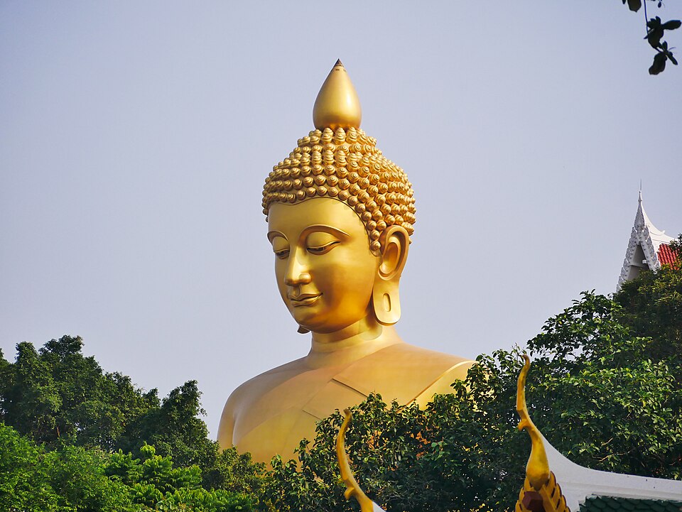 Towering golden Buddha of Wat Paknam Phasi Charoen in Bangkok Thailand. Featured in The White Lotus season 3.